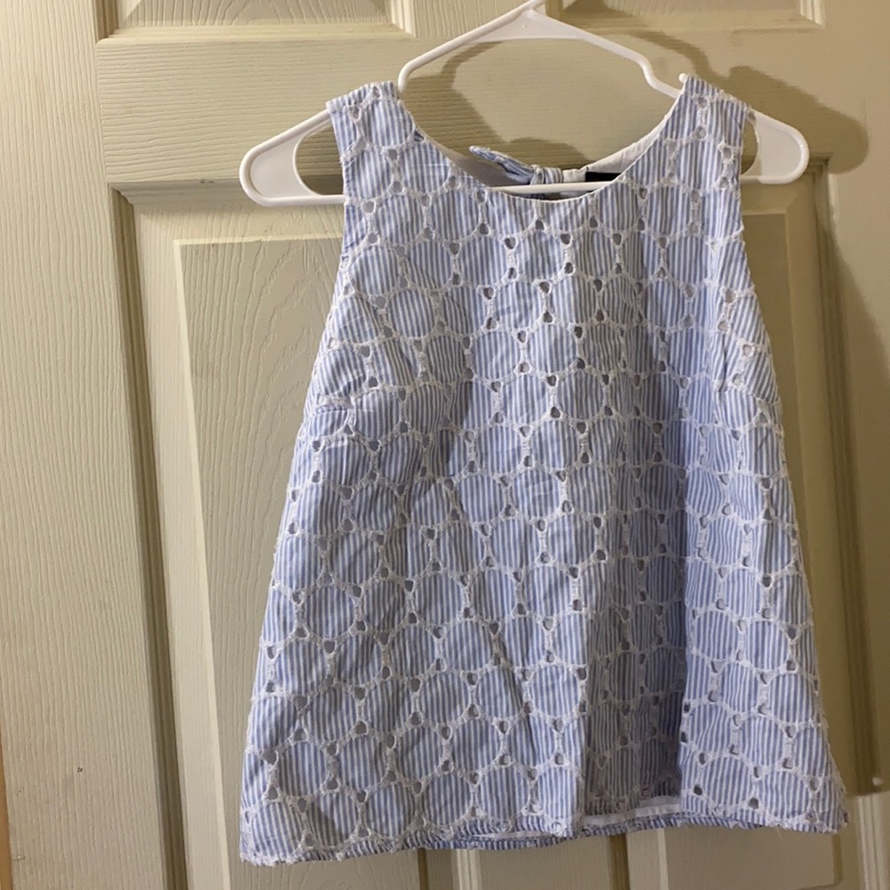 Striped shirt with opening in back